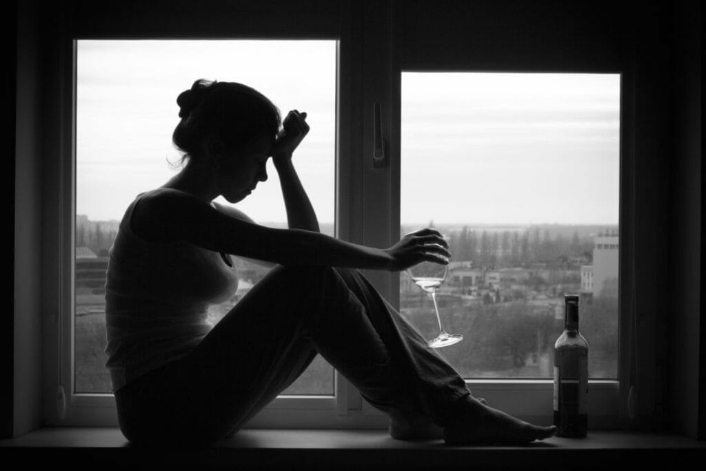 depressed woman struggling with alcoholism